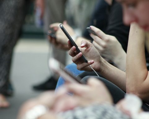 person holding black phone