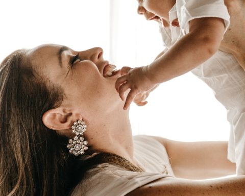 woman holding baby up