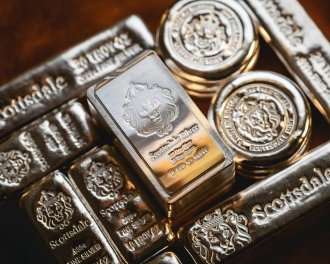 a bunch of silver bars sitting on top of each other