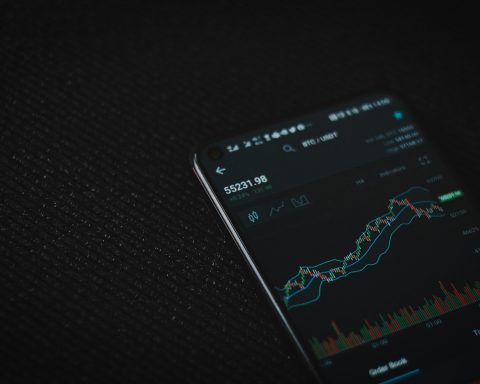 black android smartphone on black textile