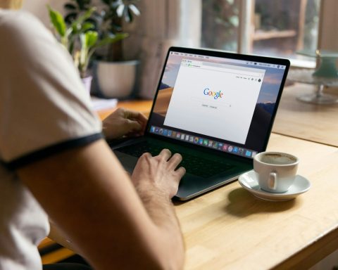 person using black laptop computer