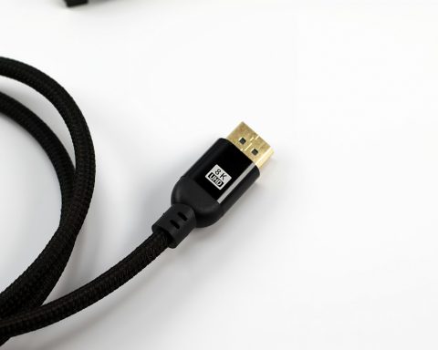 A black braided cable with a gold connector.